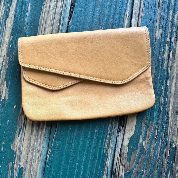Accessories - an leather clutch wallet with a boho